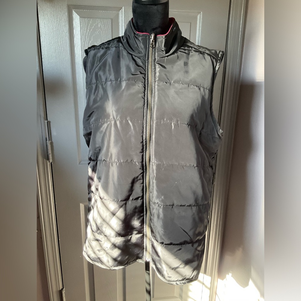 B. Boutique medium black snow vest with soft red interior